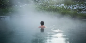 Person in cold water plunge for therapy